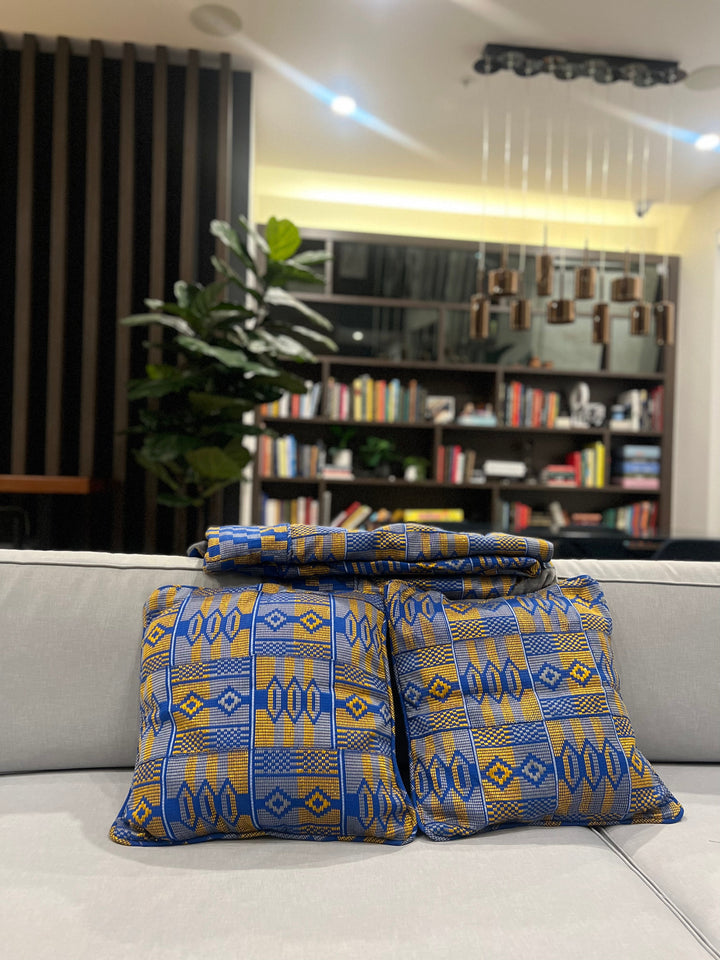 Colorful Kente print throw pillow and blanket, an essential element for unique Kente bedroom accessories and Kente cloth throws by Obrempong Home