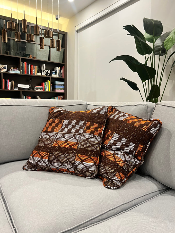 Add cultural richness to your space with these artisan-crafted Kente throw pillows, blending traditional Kente fabric into home design
