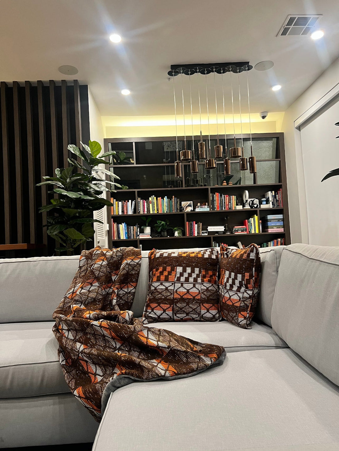 Experience the artistry of traditional Kente fabric in these beautifully designed throw pillows & blanket- perfect for Kente-inspired home interiors