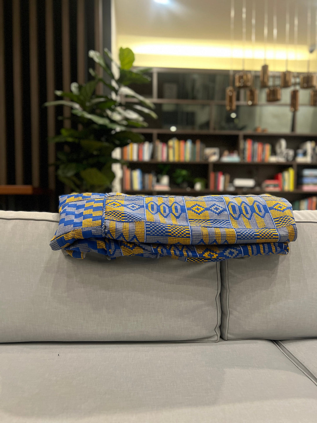 Artisan-made Kente throw pillow, an exquisite addition to custom Kente blankets for sale, contributing to cultural Kente home textiles from Obrempong Home