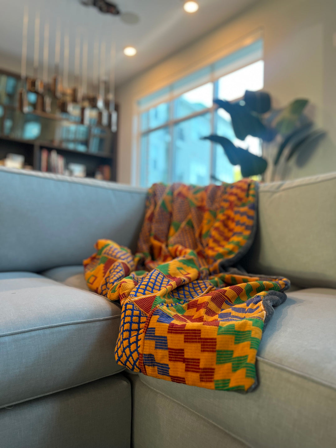 Introducing our extraordinary handmade Kente throw blanket, a true masterpiece of African artistry and cultural heritage