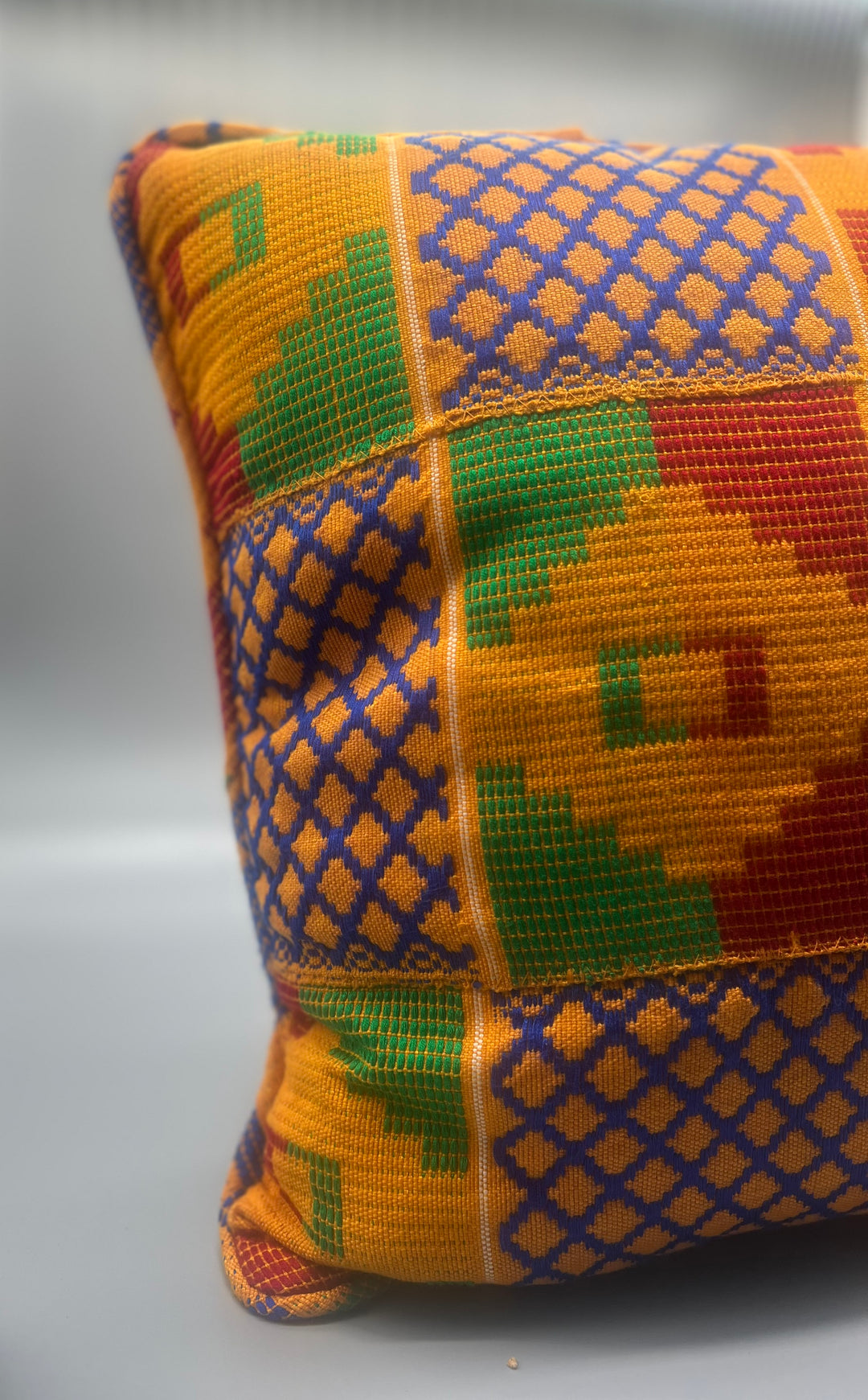 Kente Throw Pillow Yaa Asantewaa - Obrempong Home  it instantly transforms any space into a captivating sanctuary of cultural elegance.